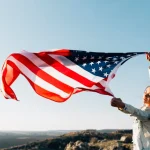 beautiful-patriotic-woman-with-fluttering-american-flags_23-2148135136 (convert.io)